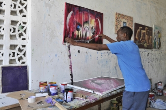 A Somali artist, Adan Farah Afey, works at the Centre for Research and Dialogue (CRD) art studio in the Wadajir District of the Somali capital Mogadishu on April 26, 2015. Many Somali artists are now able to practice their art, educating the masses on social issues, promoting peace and advocating for good governance and unity, among other issues.  Mogadishu and most parts areas of Somalia are now enjoying the longest period of peace in years after sustained military operations by the Somali National Army (SNA) backed by African Union Mission in Somalia (AMISOM) forced Al shabab to retreat from most towns of the country. AMISOM Photo / Ilyas Ahmed